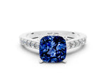 Cushion Cut Blue Sapphire Solitaire Ring in Platinum with Crossover Gallery and Round Pavé Band