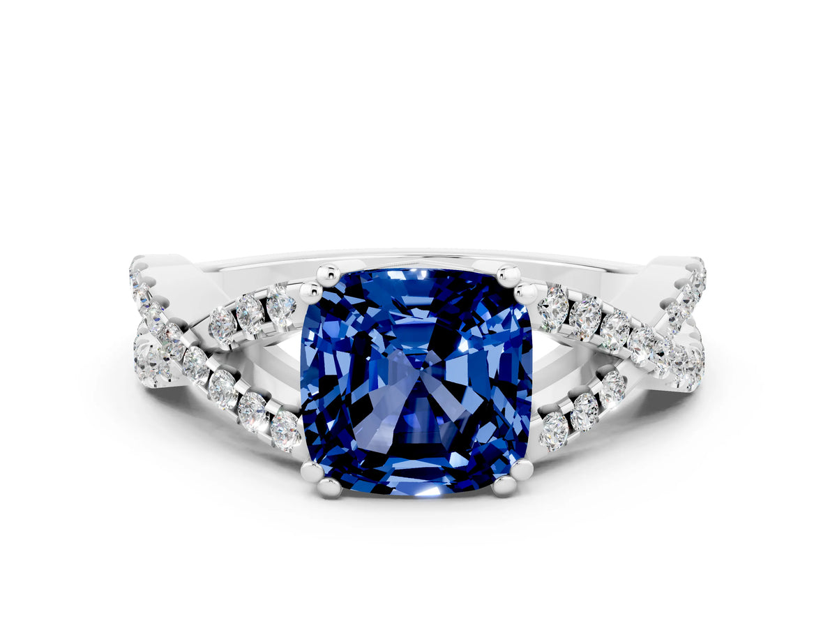 Cushion Cut Blue Sapphire Solitaire Ring in White gold with Interwoven Pavé Band and Prong Setting