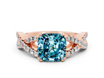 Cushion Cut Blue Topaz Solitaire Ring in Rose gold with Interwoven Pavé Band and Prong Setting