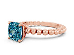Cushion Cut Blue Topaz Solitaire Ring in Rose gold with Textured Beaded Band and Prong Setting