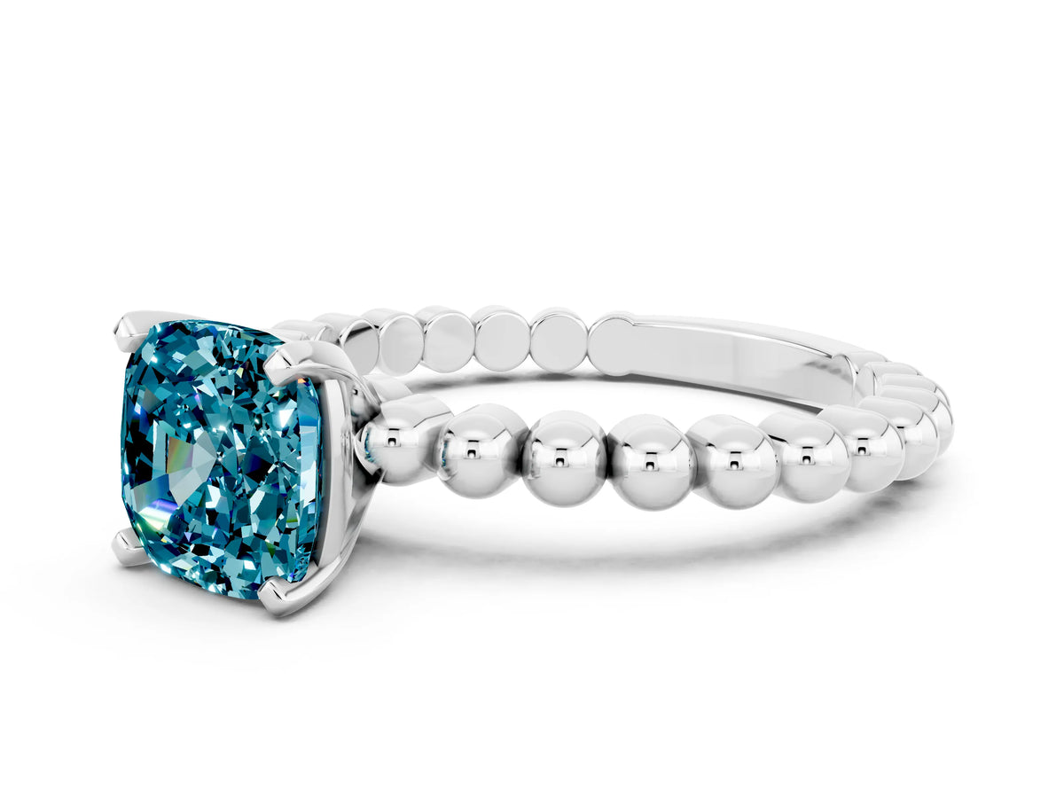Cushion Cut Blue Topaz Solitaire Ring in White gold with Textured Beaded Band and Prong Setting