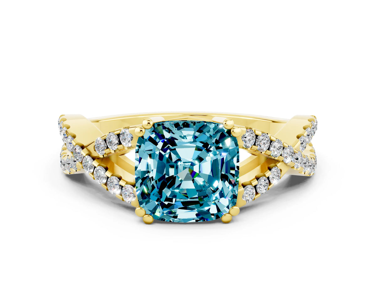 Cushion Cut Blue Topaz Solitaire Ring in Yellow gold with Interwoven Pavé Band and Prong Setting