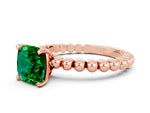 Cushion Cut Emerald Solitaire Ring in Rose gold with Textured Beaded Band and Prong Setting