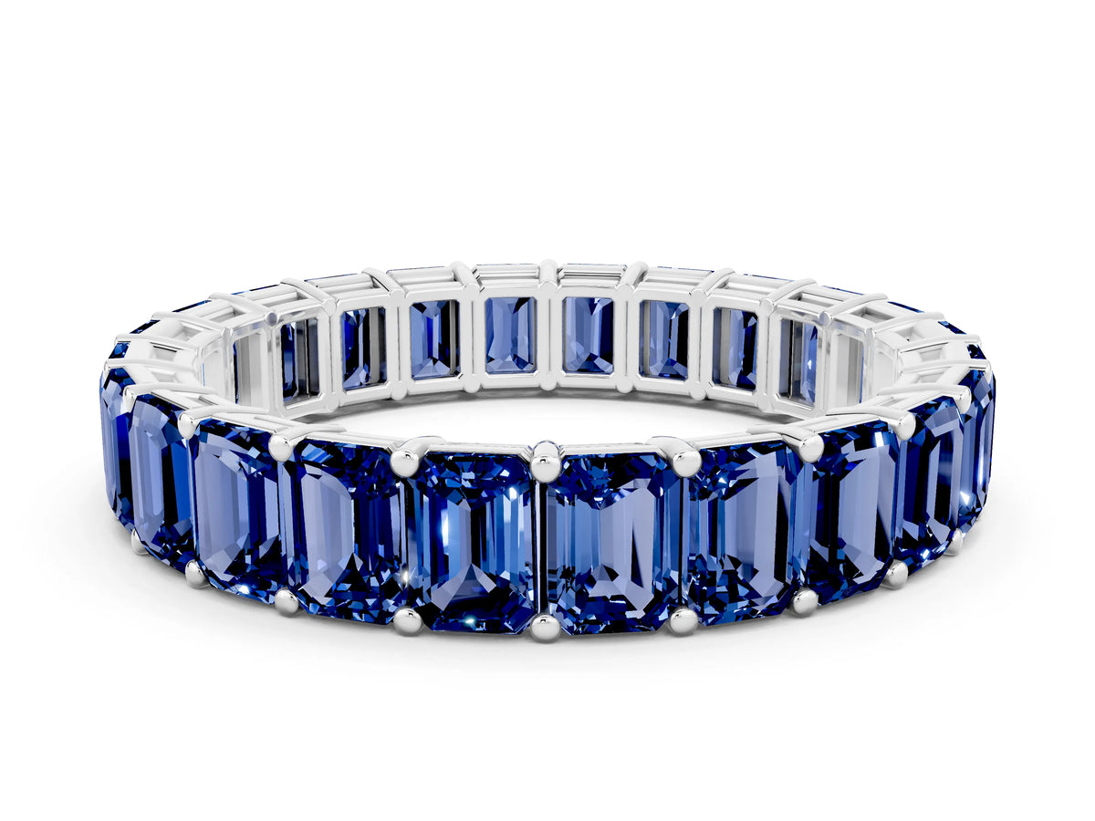 Emerald Cut Blue Sapphire Eternity Band in White gold with Aligned Shared Prong Setting