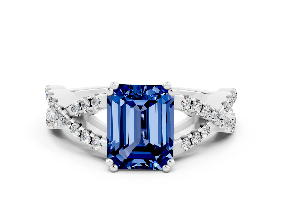 Emerald Cut Blue Sapphire Solitaire Ring in White gold with Interwoven Pavé Band and Prong Setting