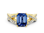 Emerald Cut Blue Sapphire Solitaire Ring in Yellow gold with Interwoven Pavé Band and Prong Setting