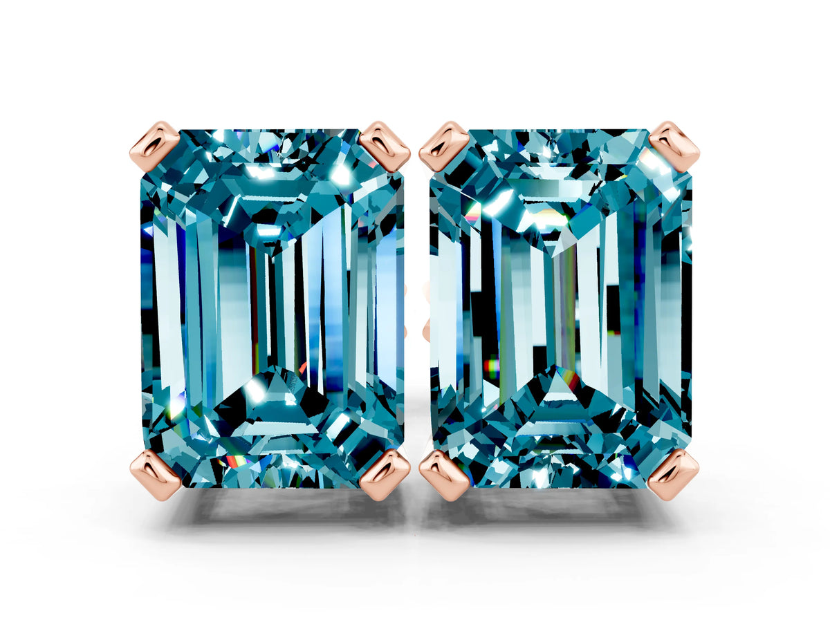 Emerald Cut Blue Topaz Stud Earrings in Rose gold with Basket Setting