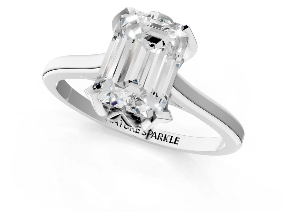 Emerald Cut Diamond Solitaire Ring in White gold with Flower Prong Setting