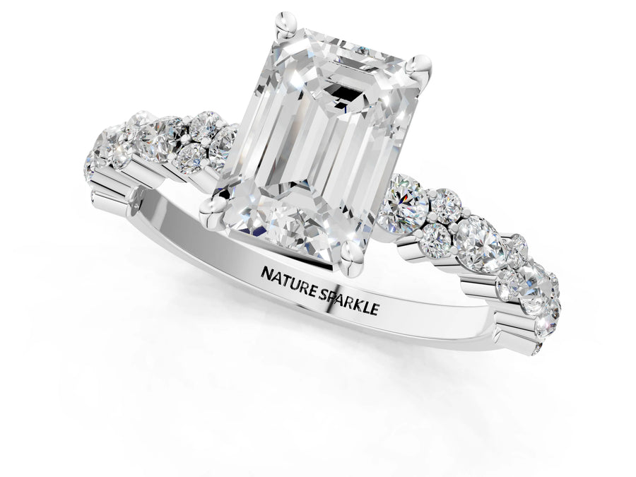 Emerald Cut Diamond Solitaire Ring in White gold with Pear and Round Cluster Band