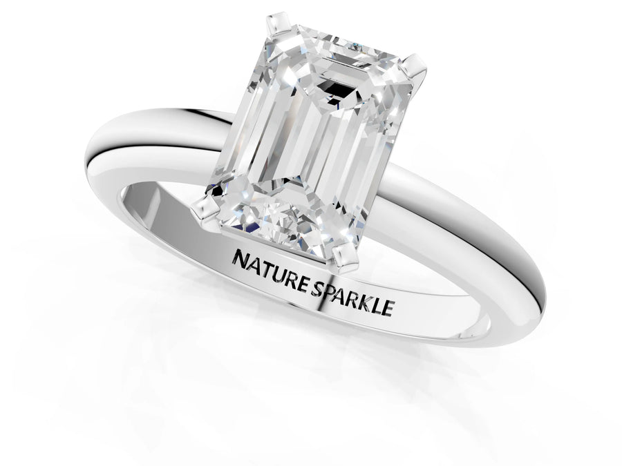 Emerald Cut Diamond Solitaire Ring in White gold with Prong Setting and Rounded Band