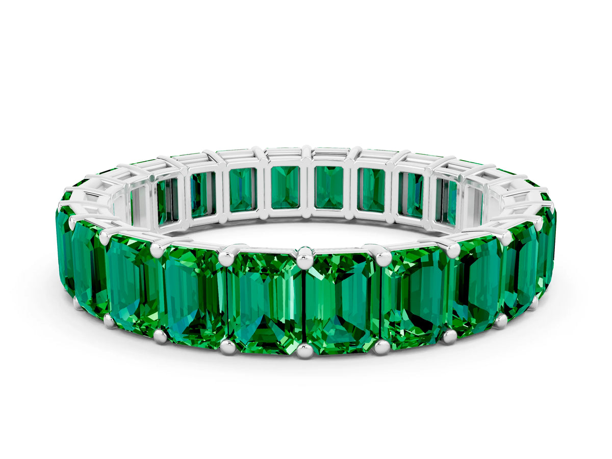 Emerald Cut Emerald Eternity Band in White gold with Aligned Shared Prong Setting