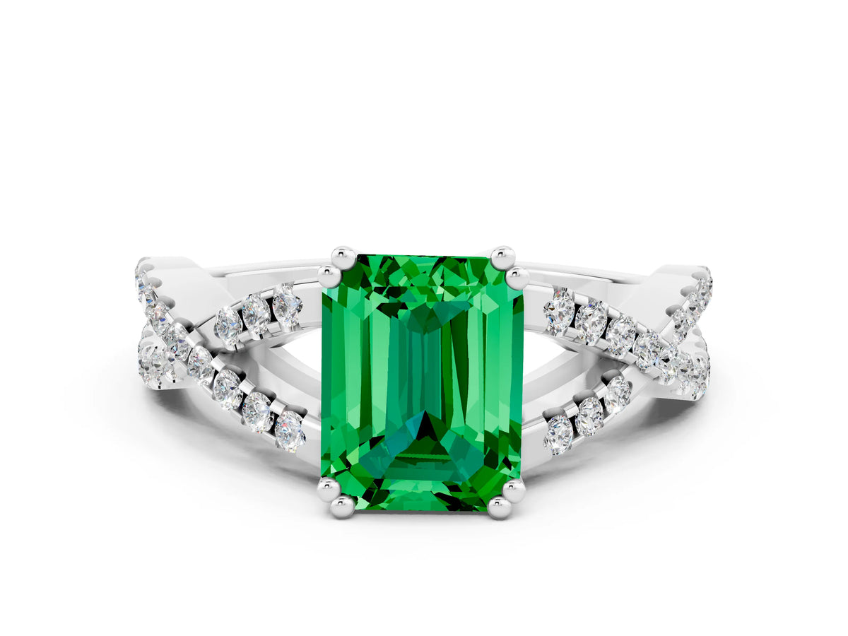 Emerald Cut Emerald Solitaire Ring in White gold with Interwoven Pavé Band and Prong Setting