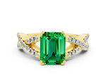 Emerald Cut Emerald Solitaire Ring in Yellow gold with Interwoven Pavé Band and Prong Setting