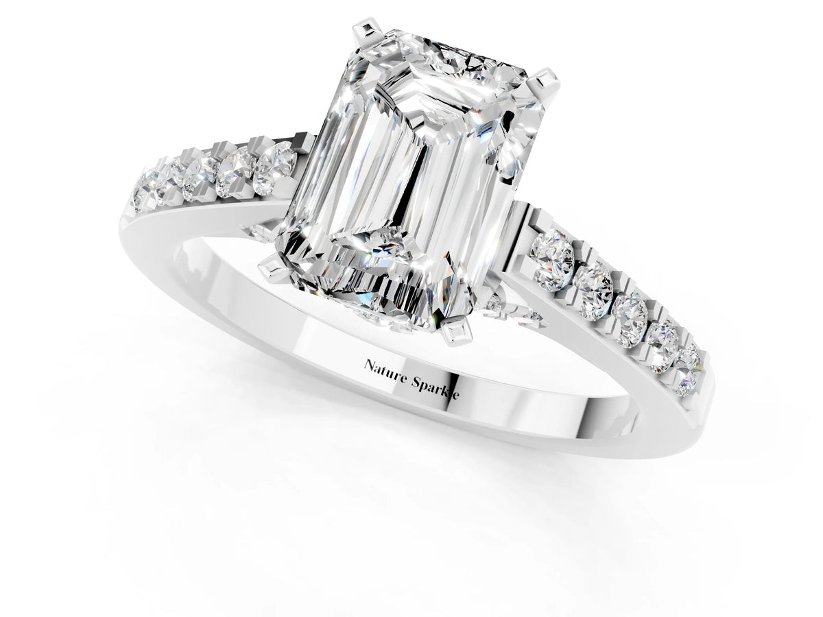 Emerald Cut Moissanite Solitaire Ring in White gold with Crossover Gallery and Round Pavé Band_1
