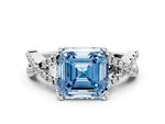 Fancy Blue Asscher Cut Diamond Solitaire Ring in White gold with Interwoven Pavé Band and Prong Setting