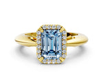 Fancy Blue Emerald Cut Diamond Halo Engagement Ring in Yellow gold with Plain Split Shank and Prong Setting
