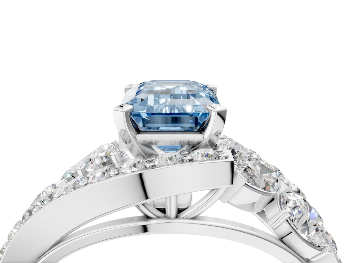 Fancy Blue Emerald Cut Diamond Halo Ring in White gold with Marquise and Pavé Band in Prong Setting_4