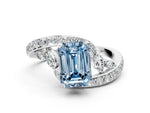 Fancy Blue Emerald Cut Diamond Solitaire Ring in White gold with Pavé Twist Band and Prong Setting