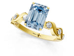 Fancy Blue Emerald Cut Diamond Solitaire Ring in Yellow gold with Twisted Ribbon Band and Round Accents_1