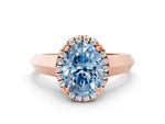 Fancy Blue Oval Cut Diamond Halo Ring in Rose gold with Cathedral Band and Prong Setting