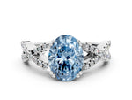 Fancy Blue Oval Cut Diamond Solitaire Ring in White gold with Interwoven Pavé Band and Prong Setting
