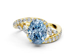 Fancy Blue Oval Cut Diamond Solitaire Ring in Yellow gold with Pavé Twist Band and Prong Setting