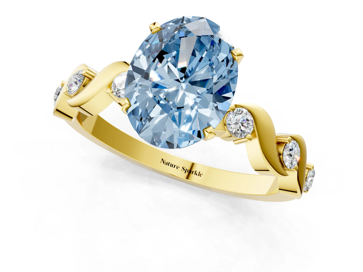 Fancy Blue Oval Cut Diamond Solitaire Ring in Yellow gold with Twisted Ribbon Band and Round Accents_1