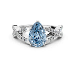 Fancy Blue Pear Cut Diamond Solitaire Ring in Silver with Interwoven Pavé Band and Prong Setting_6