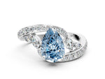 Fancy Blue Pear Cut Diamond Solitaire Ring in White gold with Pavé Twist Band and Prong Setting