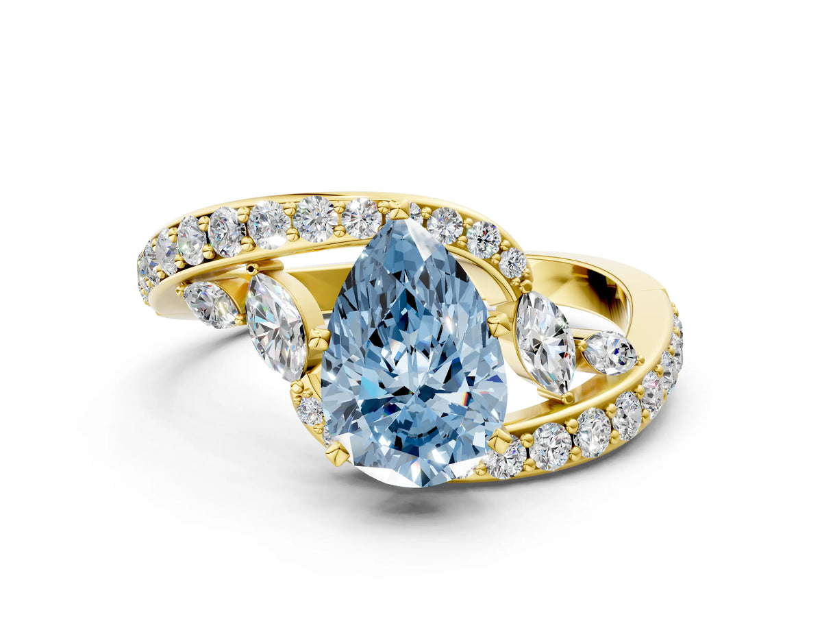 Fancy Blue Pear Cut Diamond Solitaire Ring in Yellow gold with Pavé Twist Band and Prong Setting