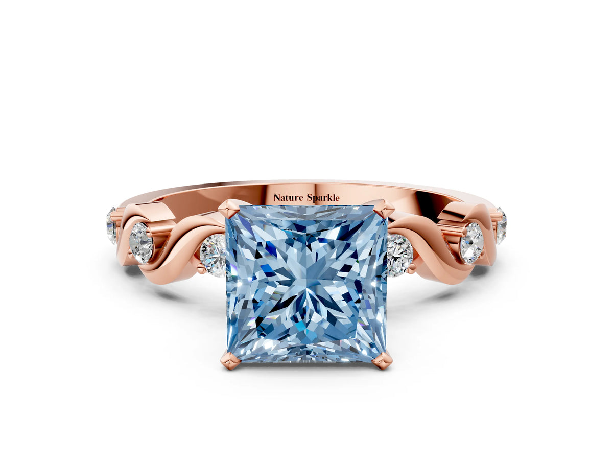 Fancy Blue Princess Cut Diamond Solitaire Ring in Rose gold with Twisted Ribbon Band and Round Accents