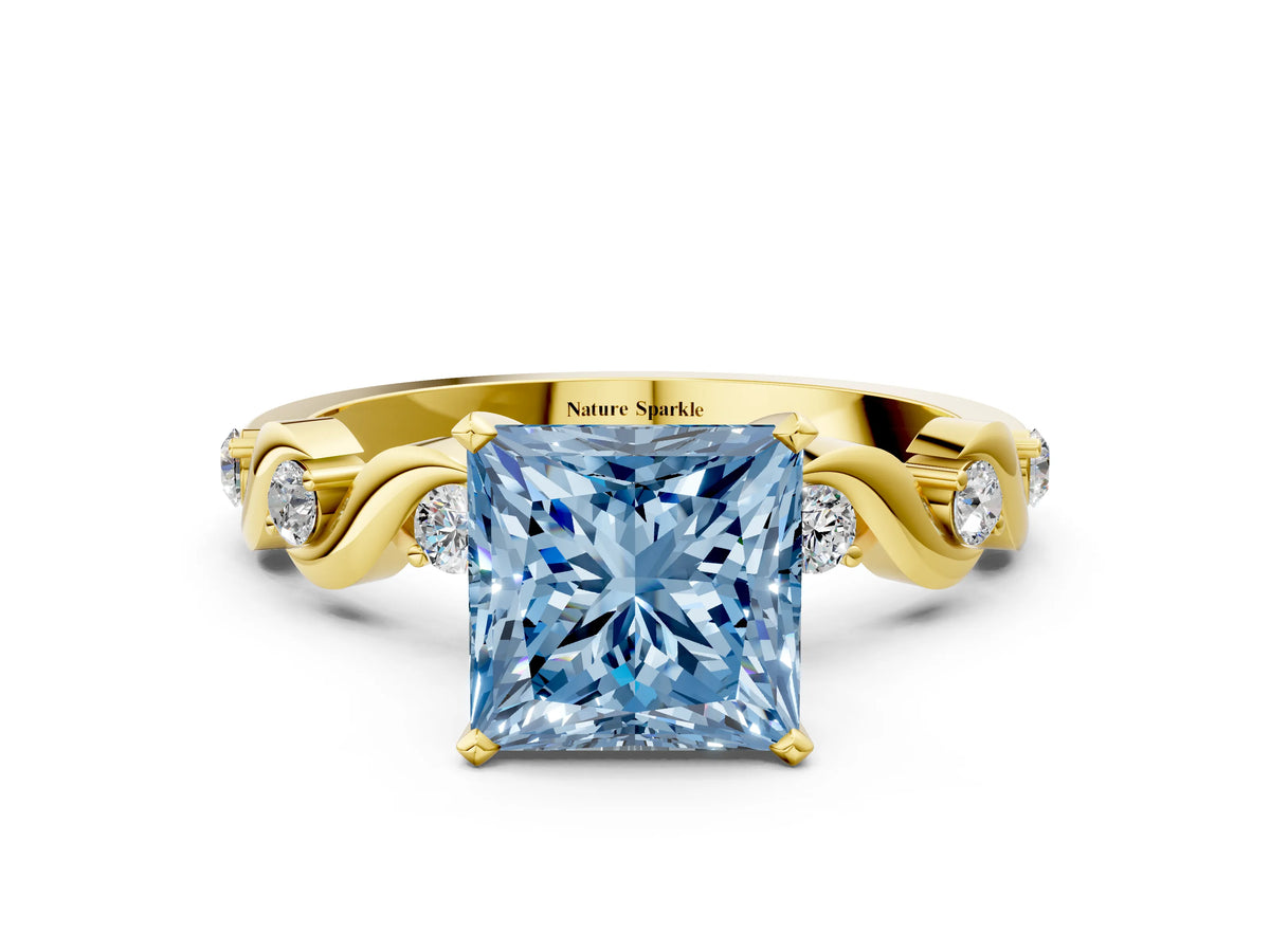 Fancy Blue Princess Cut Diamond Solitaire Ring in Yellow gold with Twisted Ribbon Band and Round Accents
