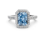 Fancy Blue Radiant Cut Diamond Halo Engagement Ring in White gold with Milgrain Detail and Pavé Band