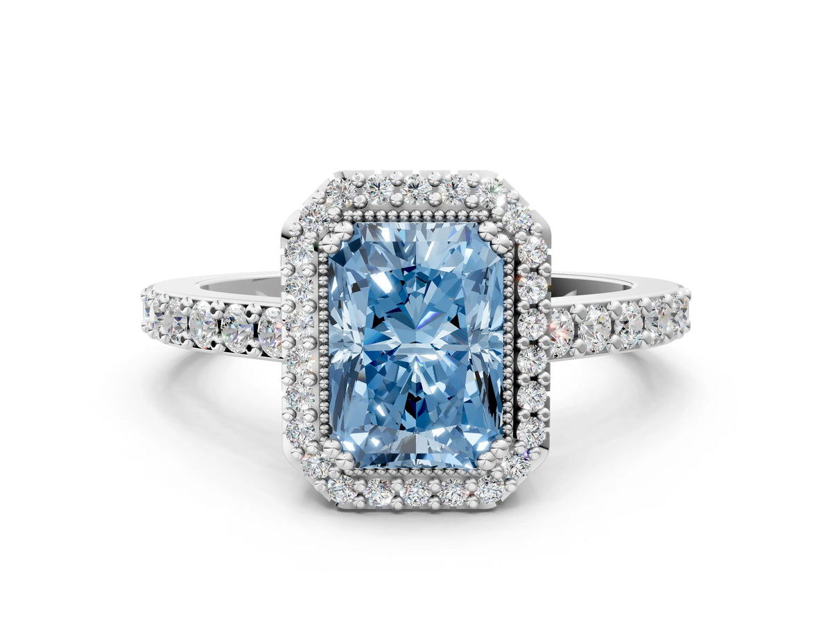 Fancy Blue Radiant Cut Diamond Halo Engagement Ring in White gold with Milgrain Detail and Pavé Band