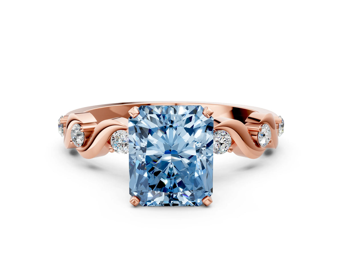 Fancy Blue Radiant Cut Diamond Solitaire Ring in Rose gold with Twisted Ribbon Band and Round Accents