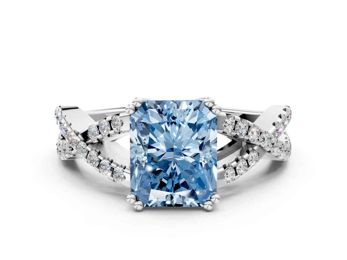 Fancy Blue Radiant Cut Diamond Solitaire Ring in White gold with Interwoven Pavé Band and Prong Setting