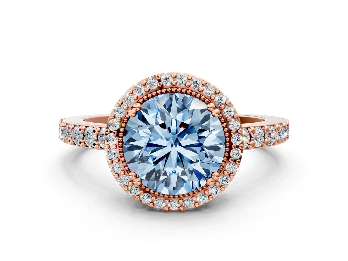 Fancy Blue Round Cut Diamond Halo Engagement Ring in Rose gold with Milgrain Detail and Pavé Band