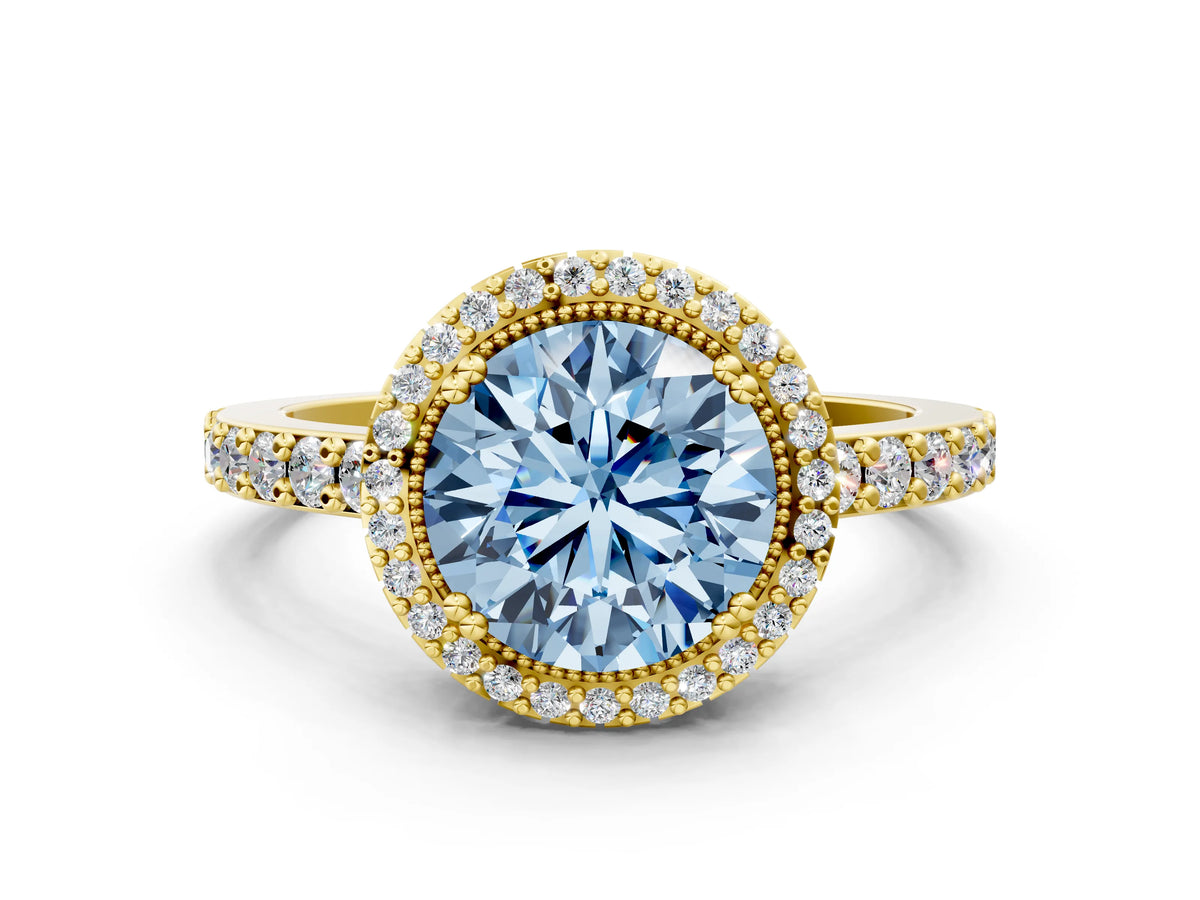 Fancy Blue Round Cut Diamond Halo Engagement Ring in Yellow gold with Milgrain Detail and Pavé Band