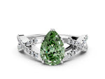 Fancy Green Pear Cut Diamond Solitaire Ring in White gold with Interwoven Pavé Band and Prong Setting