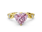 Fancy Pink Heart Cut Diamond Solitaire Ring in Yellow gold with Twisted Ribbon Band and Round Accents
