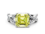 Fancy Yellow Asscher Cut Diamond Solitaire Ring in White gold with Interwoven Pavé Band and Prong Setting
