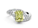 Fancy Yellow Emerald Cut Diamond Solitaire Ring in White gold with Pavé Twist Band and Prong Setting