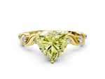 Fancy Yellow Heart Cut Diamond Solitaire Ring in Yellow gold with Twisted Ribbon Band and Round Accents