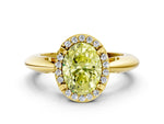 Fancy Yellow Oval Cut Diamond Halo Engagement Ring in Yellow gold with Plain Split Shank and Prong Setting