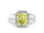 Fancy Yellow Radiant Cut Diamond Halo Ring in White gold with Cathedral Band and Prong Setting