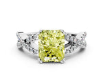 Fancy Yellow Radiant Cut Diamond Solitaire Ring in White gold with Interwoven Pavé Band and Prong Setting