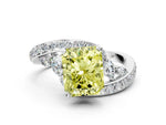 Fancy Yellow Radiant Cut Diamond Solitaire Ring in White gold with Pavé Twist Band and Prong Setting