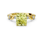 Fancy Yellow Radiant Cut Diamond Solitaire Ring in Yellow gold with Twisted Ribbon Band and Round Accents