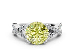 Fancy Yellow Round Cut Diamond Solitaire Ring in White gold with Interwoven Pavé Band and Prong Setting