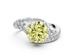 Fancy Yellow Round Cut Diamond Solitaire Ring in White gold with Pavé Twist Band and Prong Setting